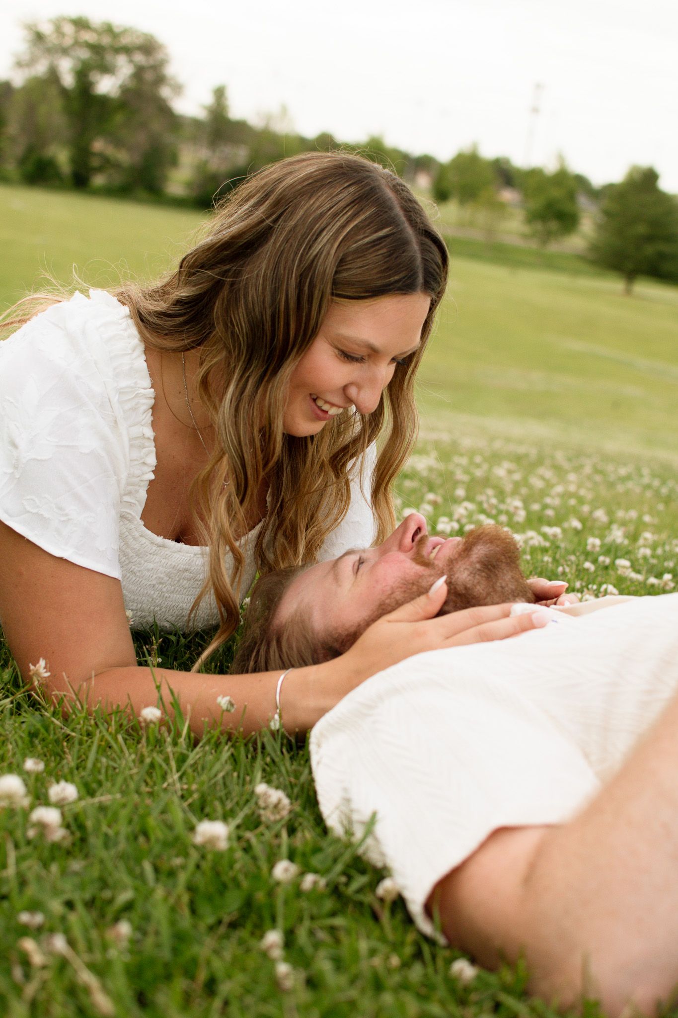 Couple laughing together during a candid photography session