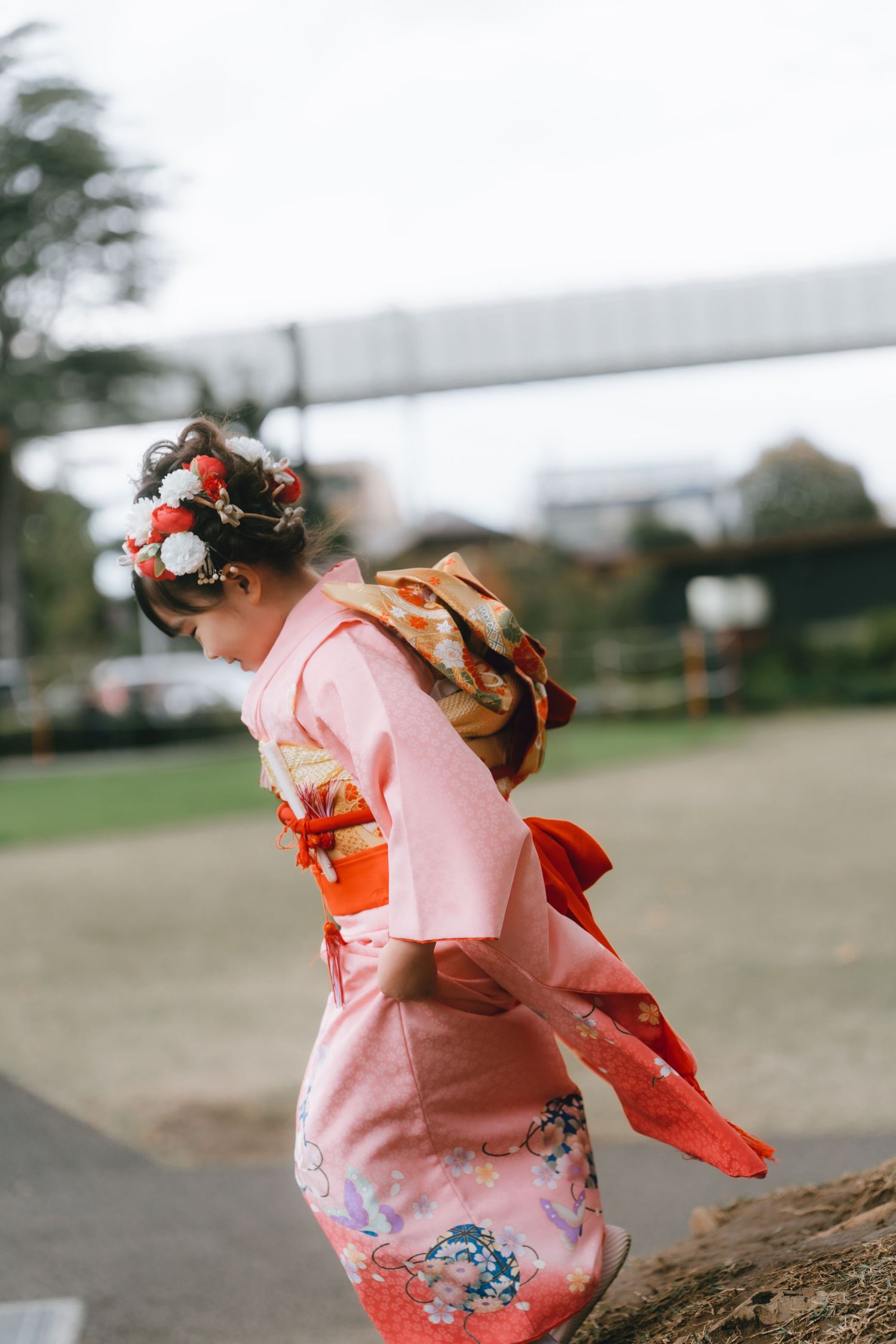 young child wearing a traditional teal haori and kimono for Shichi-Go-San at Chiba shrine, Chiba, Japan.