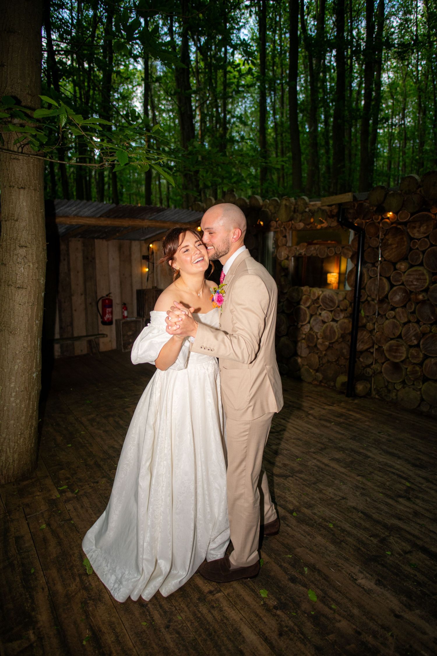 Portrait photo of the wedding couple slow dancing, it is sharp with high contrast and a blurry background.