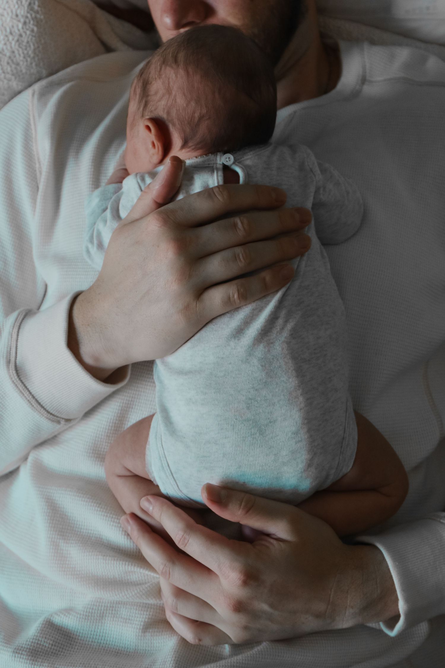 Kawartha Lakes Newborn Photography Session.
Close up detail photo of dad holding baby girl newborn daughter