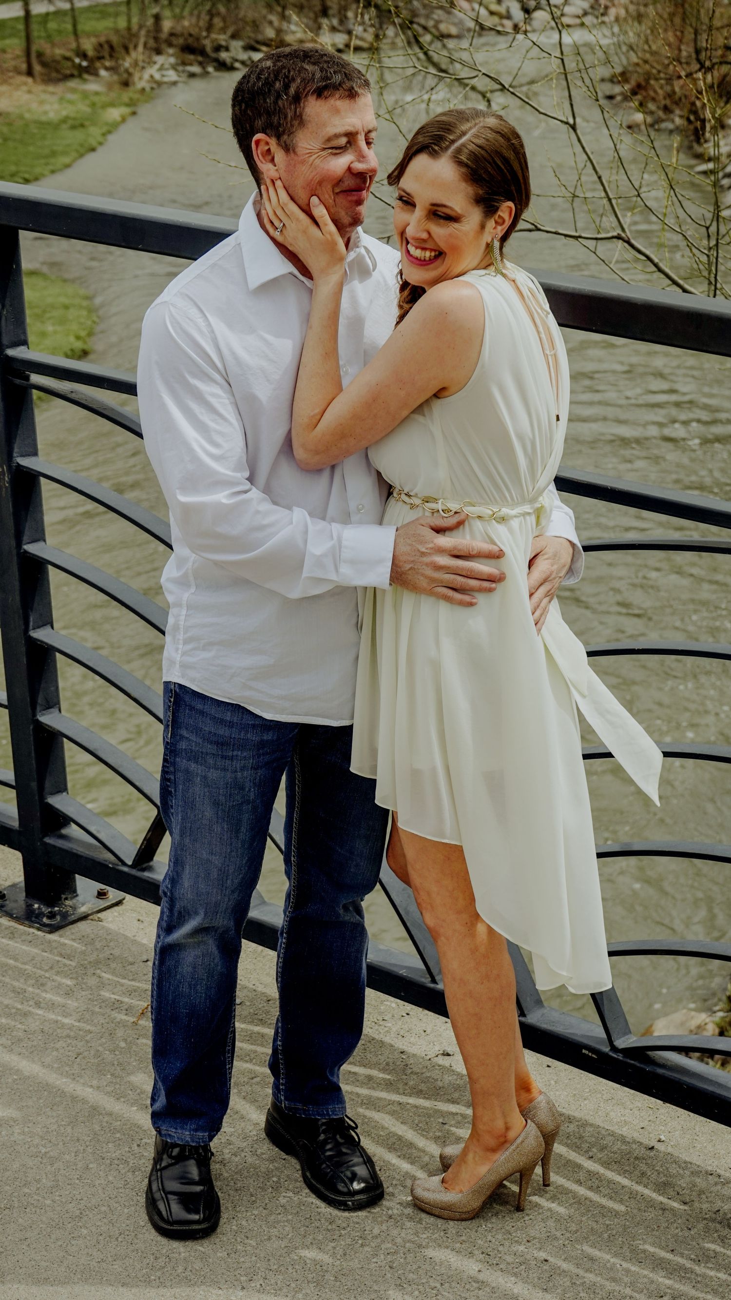 Kawartha Lakes Couples Engagement Photography Session.
Fiancé and fiancée laughing and smiling together standing on a bridge