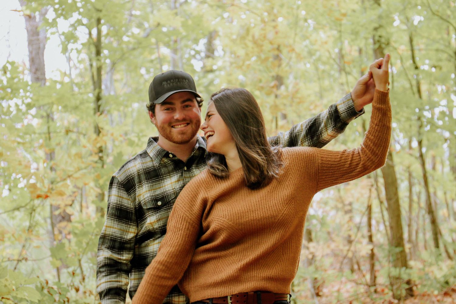 Kawartha Lakes Couple Photography Session.
Boyfriend and girlfriend playing airplane and posing while smiling and laughing at eachother