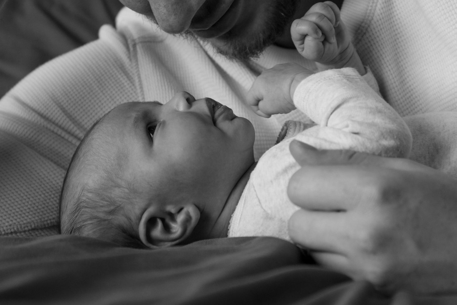 Kawartha Lakes Newborn Photography Session.
Black and white photo of newborn baby girl holding dads beard