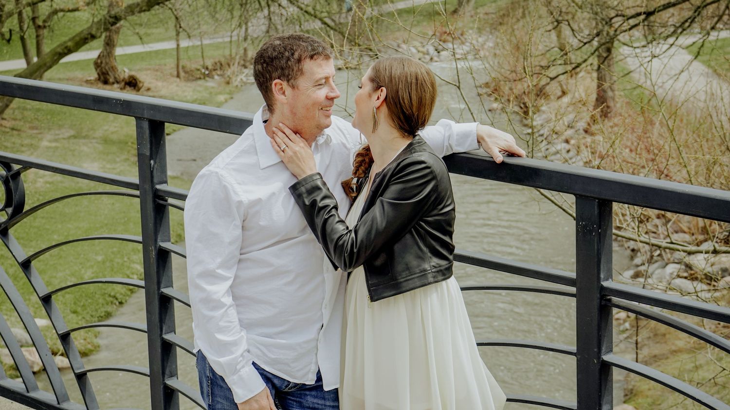Kawartha Lakes Couples Engagement Photography Session.
Fiancé and fiancée laughing and smiling together standing on a bridge