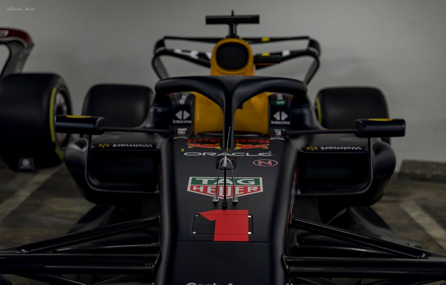 Rear view of Red Bull Oracle Racing Formula 1 car number 1 in dark livery.