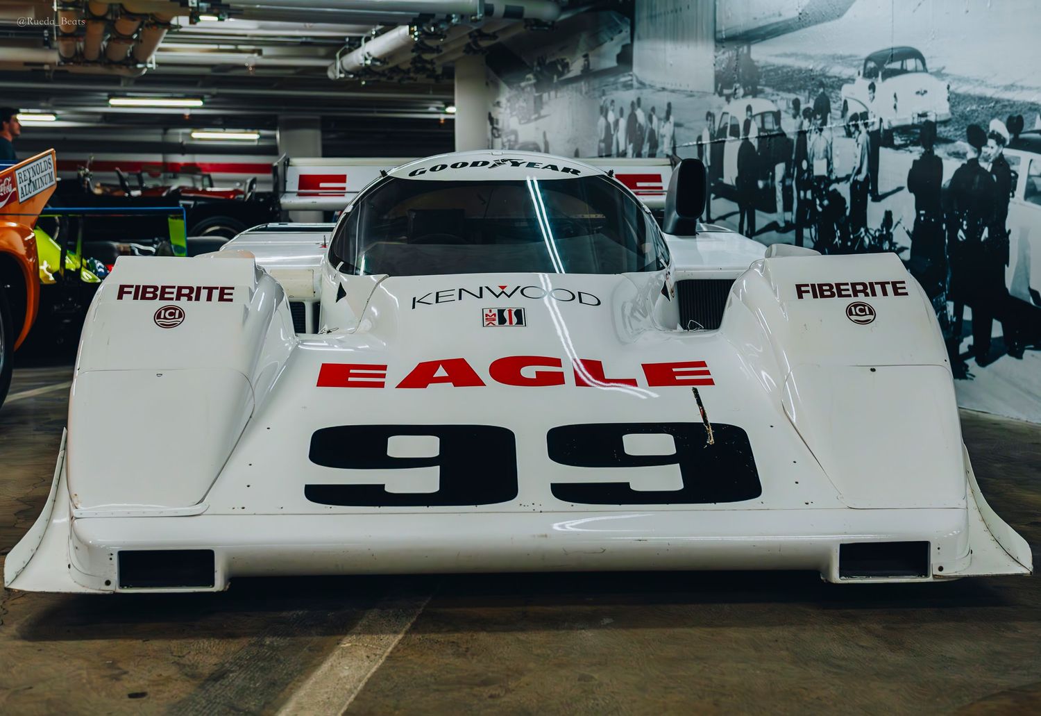 White Eagle 99 prototype racing car displayed indoors at a motorsport museum.