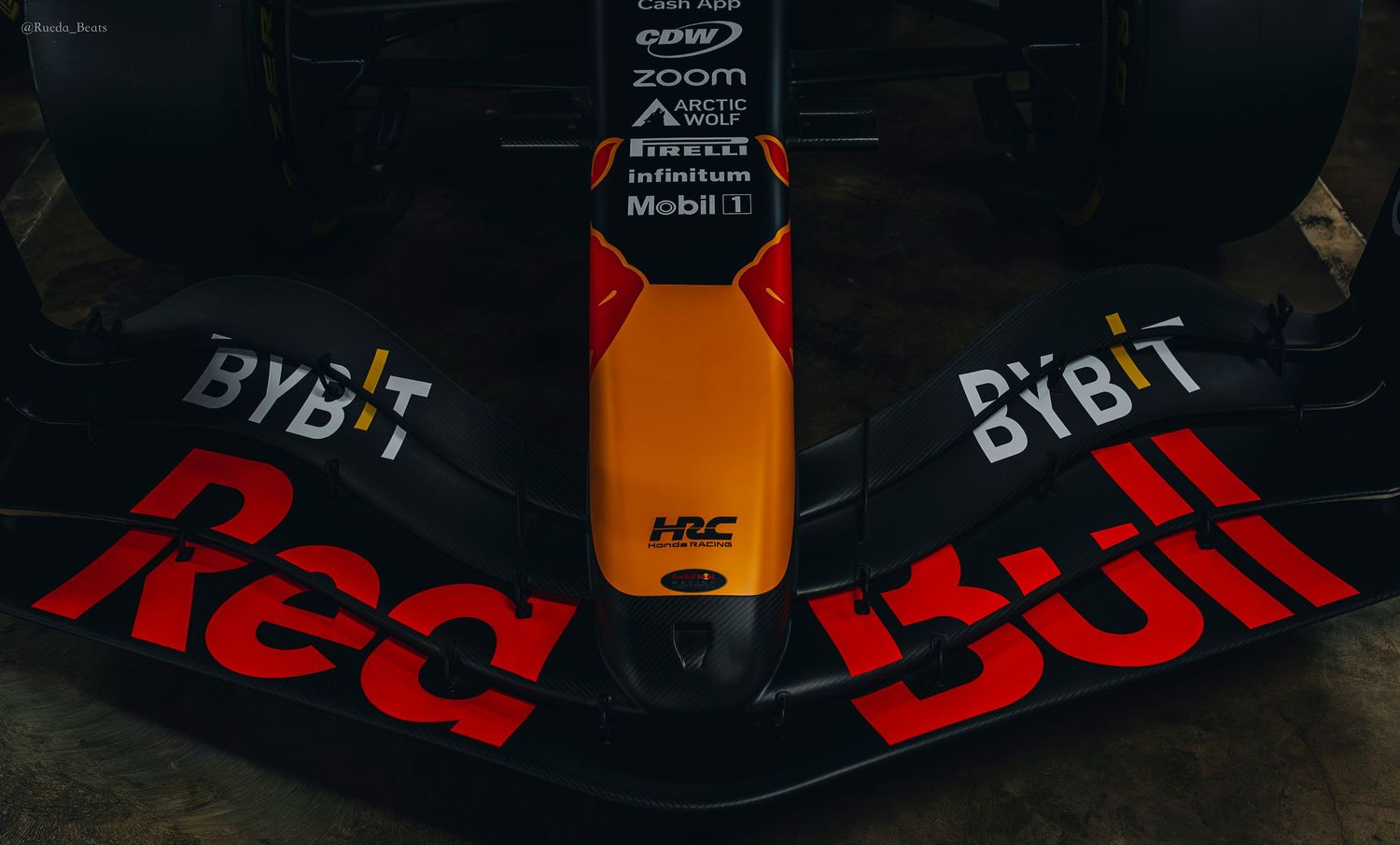 Close-up of Red Bull Racing F1 car front wing showing Bybit and HRC sponsor logos.