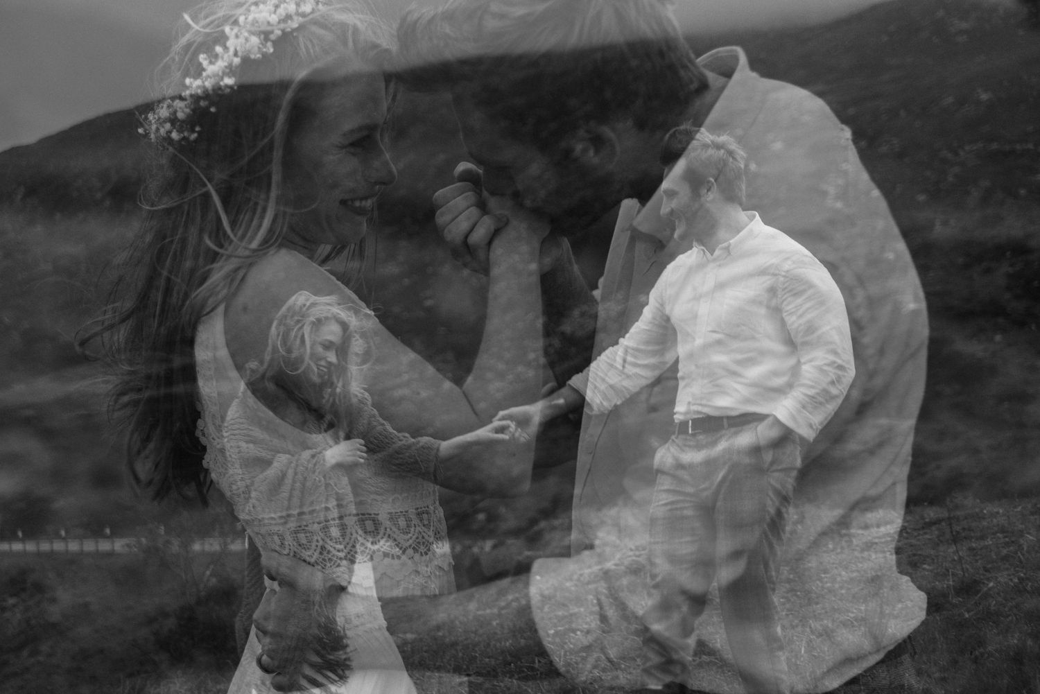 Creative double exposure black and white wedding photo of couple holding hands in highlands.