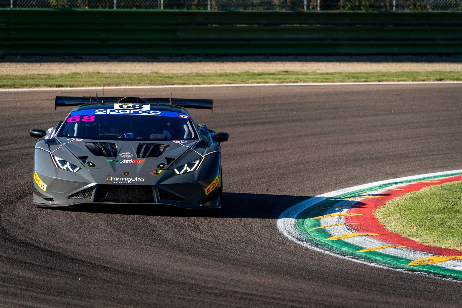 Lamborghini Huracán GT3 attacking the kerb at Imola during the CIGT Endurance race.