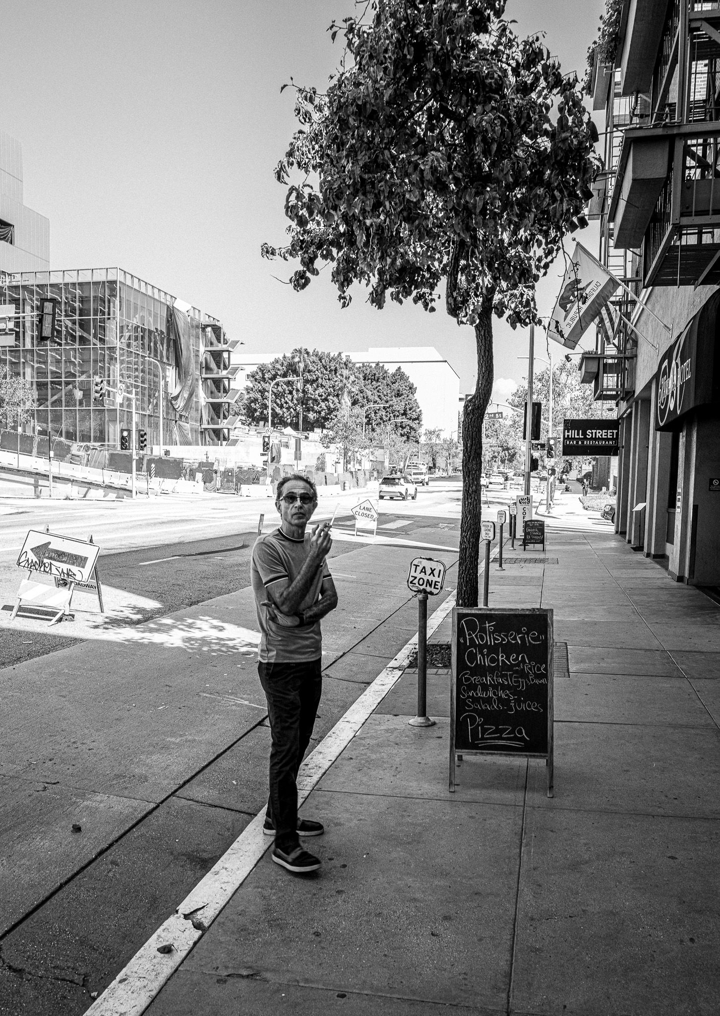 Man smoking outside cafe in Los Angeles, California