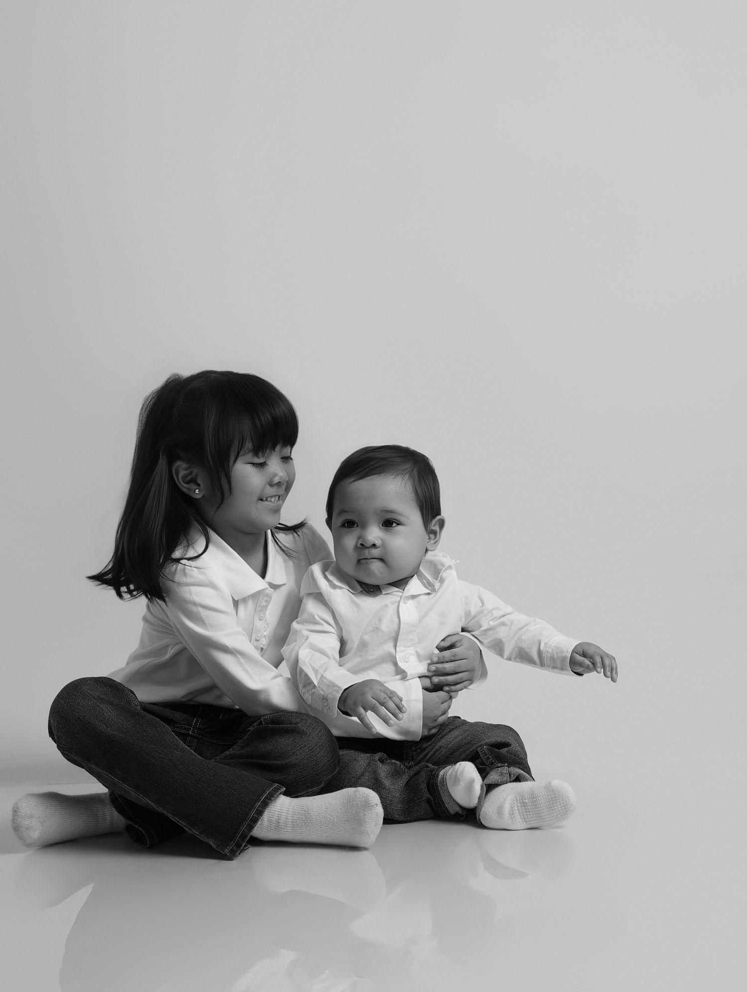 North York children’s photographer photographing siblings in nice outfits