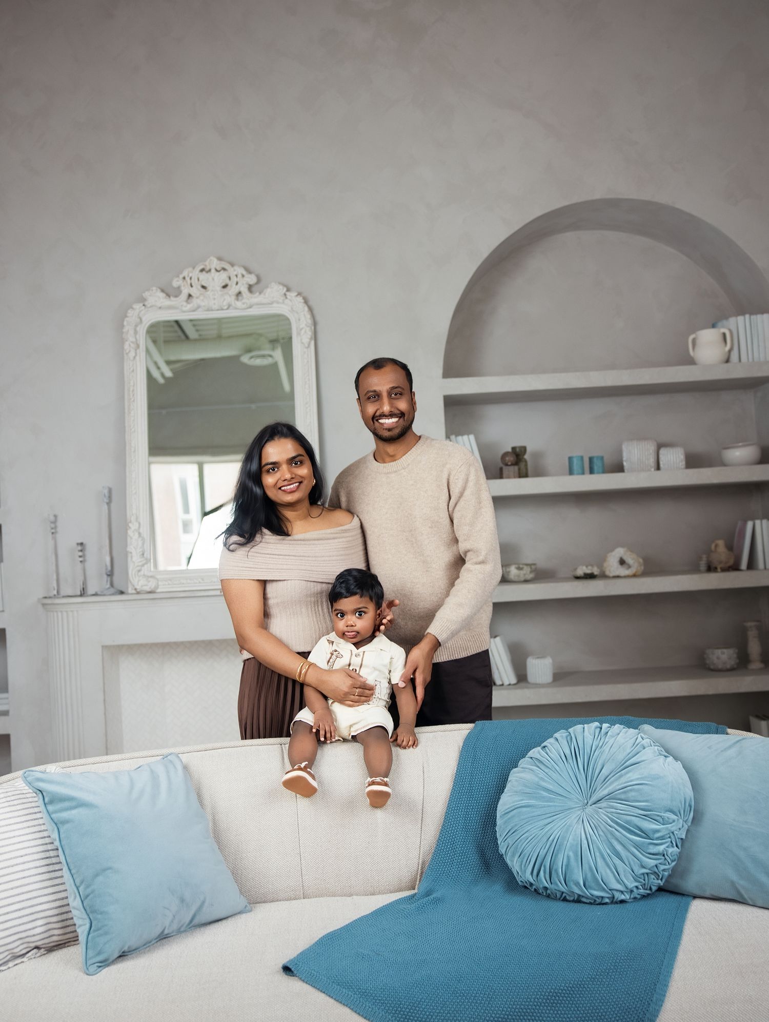 In-home family session Toronto, mother holding her toddler in the living room