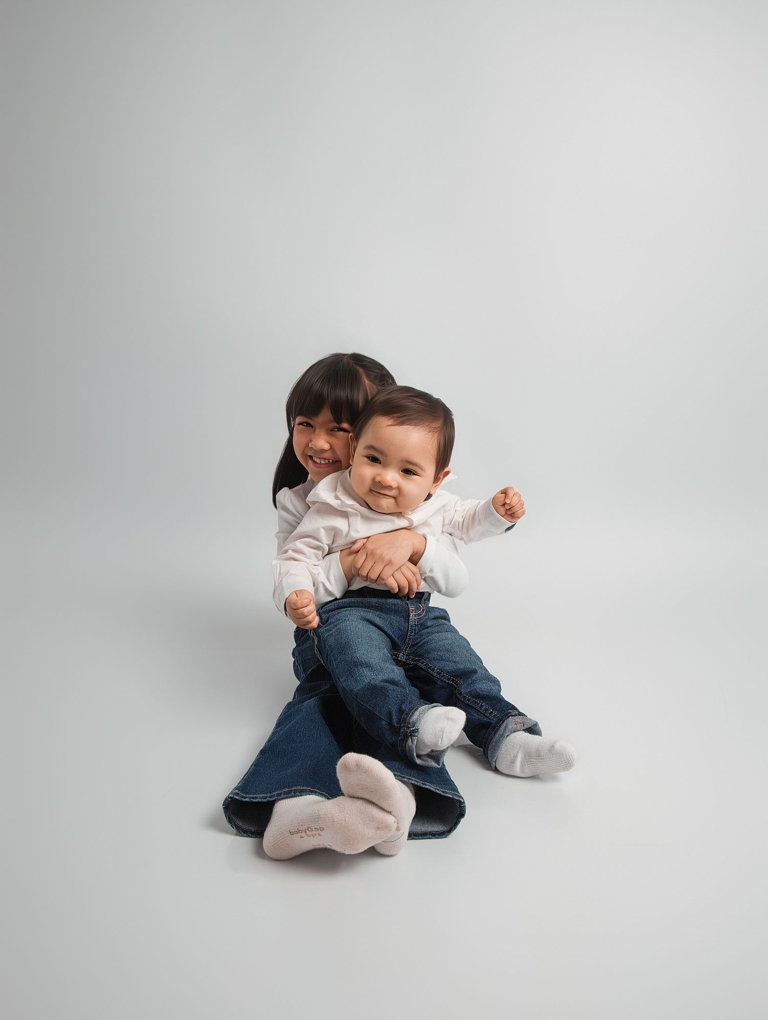 Children’s photography in North York showing a young child smiling beside a themed cake