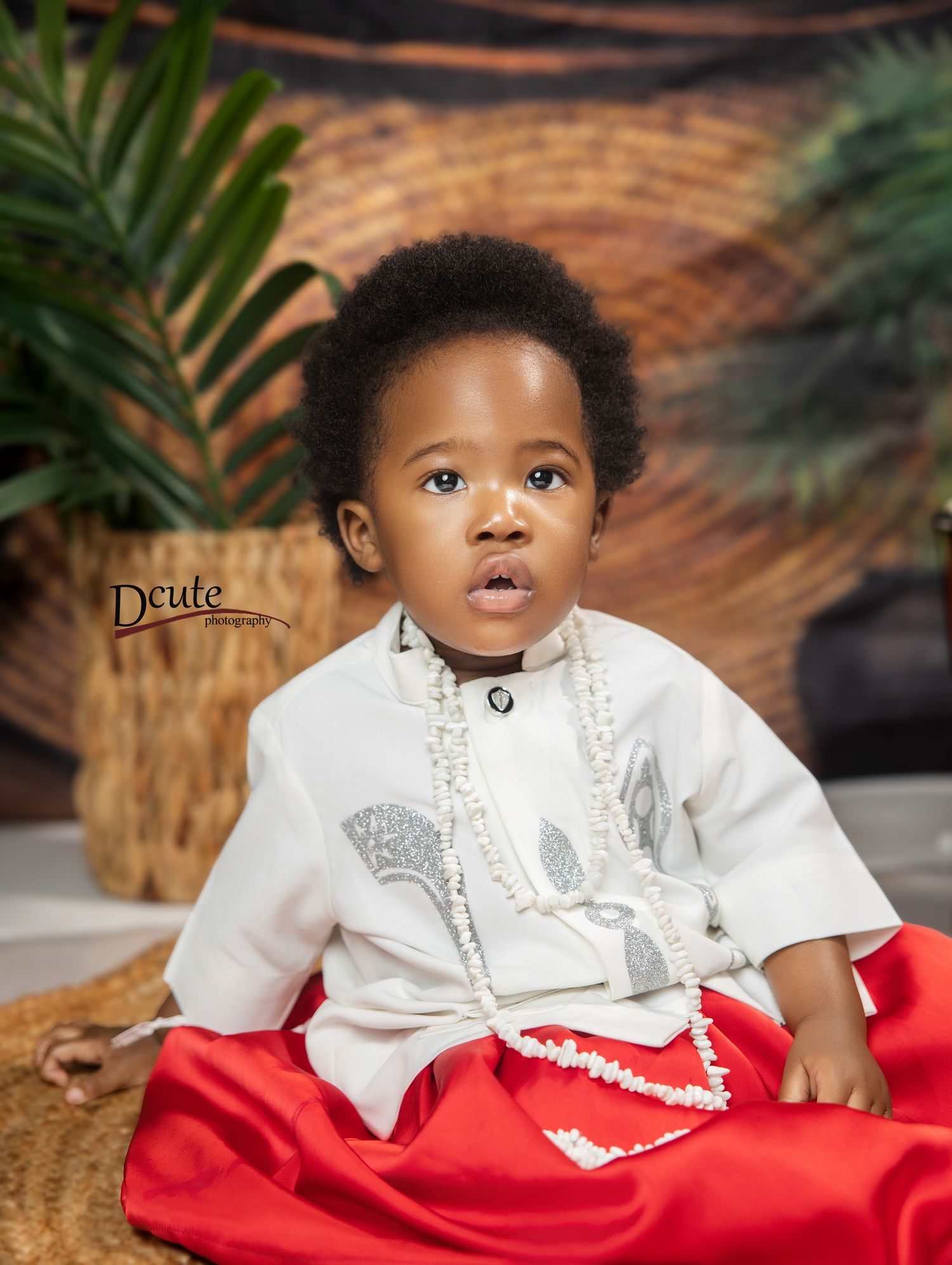 North York kids photographer, features child sitting on a mat