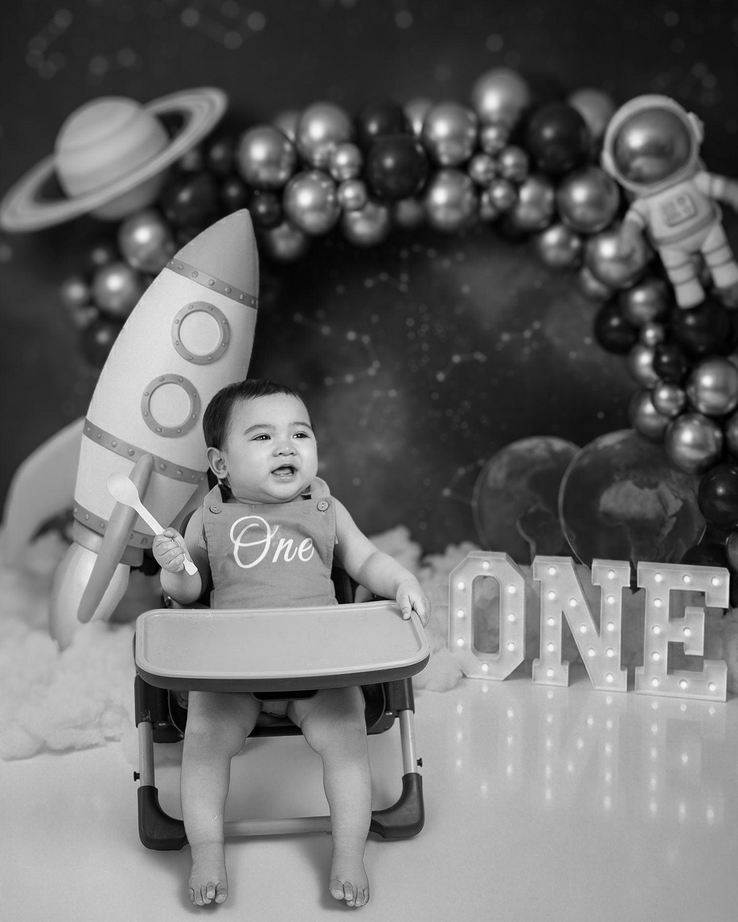 North York children’s photographer capturing a toddler surrounded by birthday decorations
