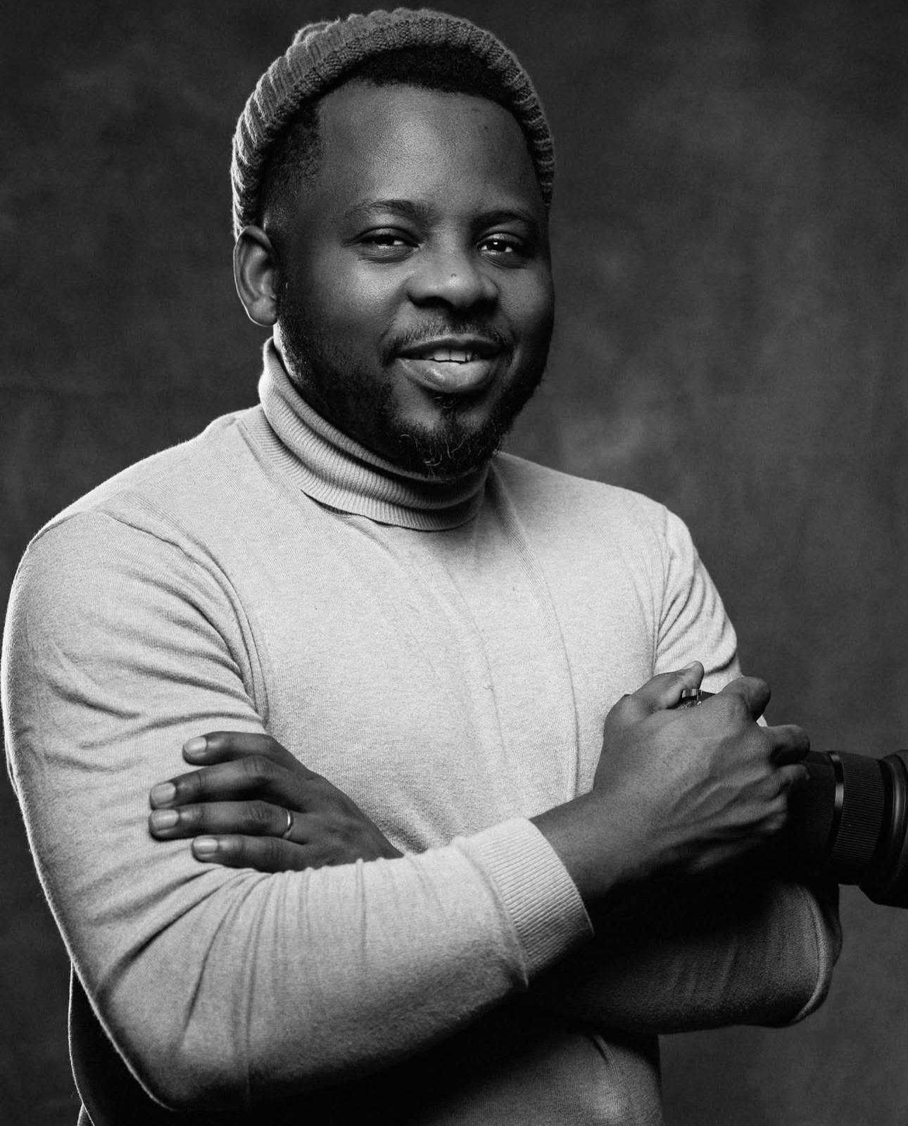 A series of black and white portraits showing emotional expressions progressing from serious to joyful.