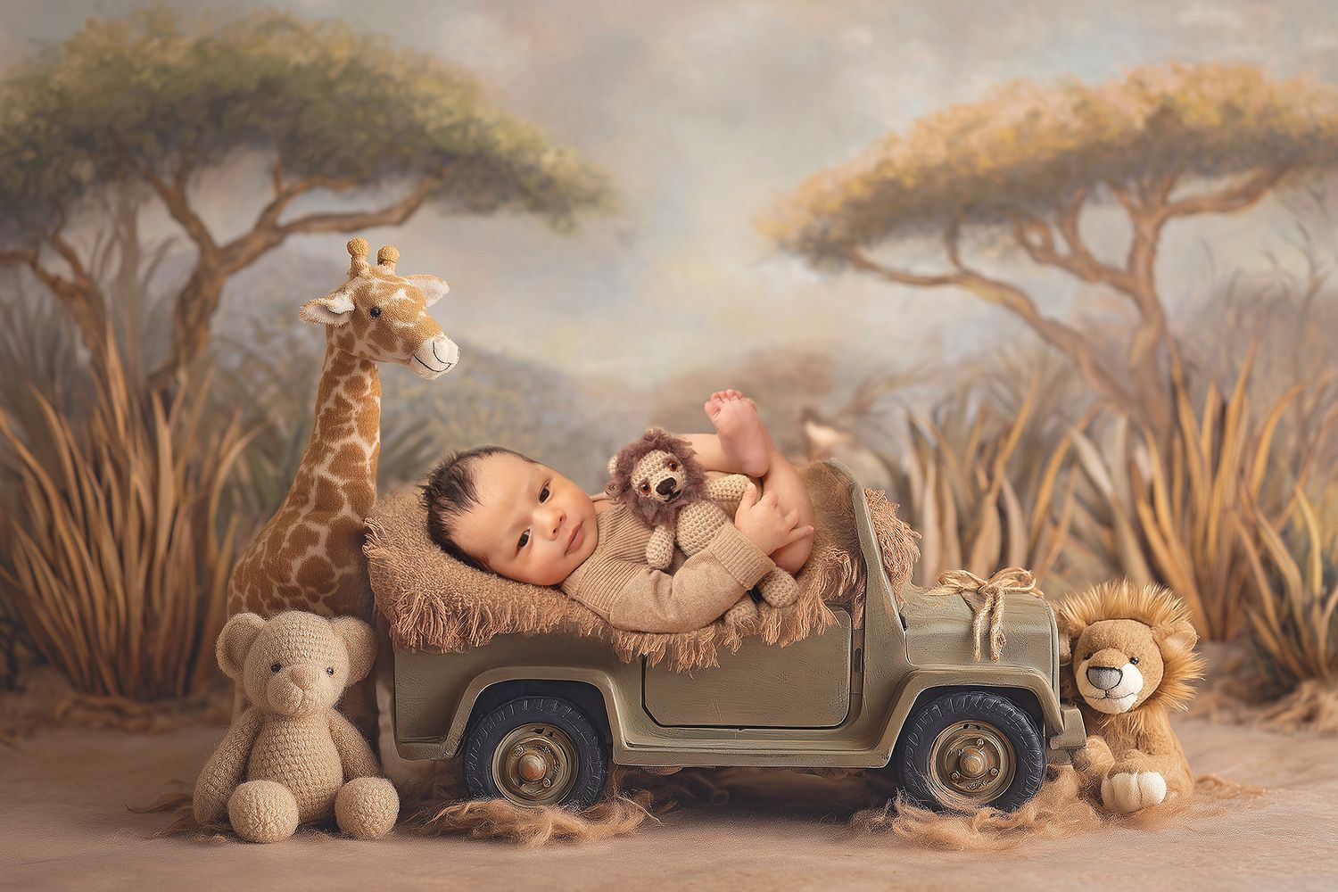 Newborn baby sleeping in a toy safari jeep surrounded by stuffed animals with a savanna backdrop.