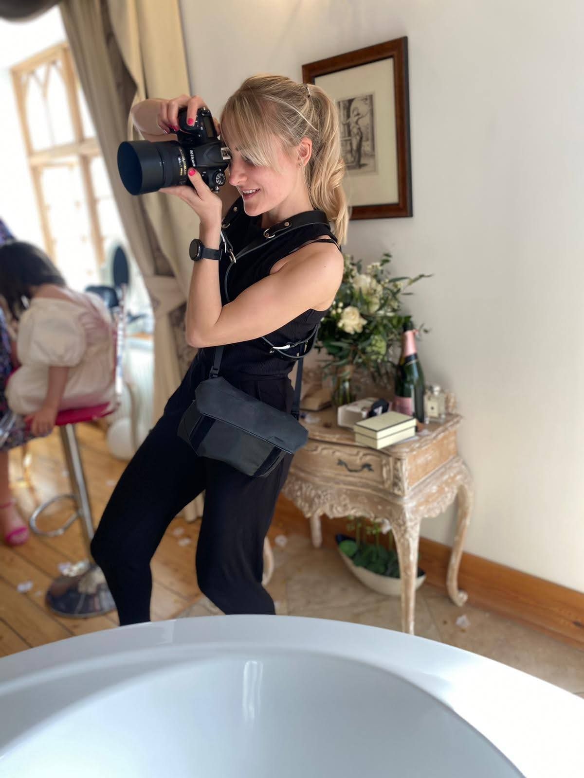 Inverness Wedding photographer capturing shots in a bright white interior room.