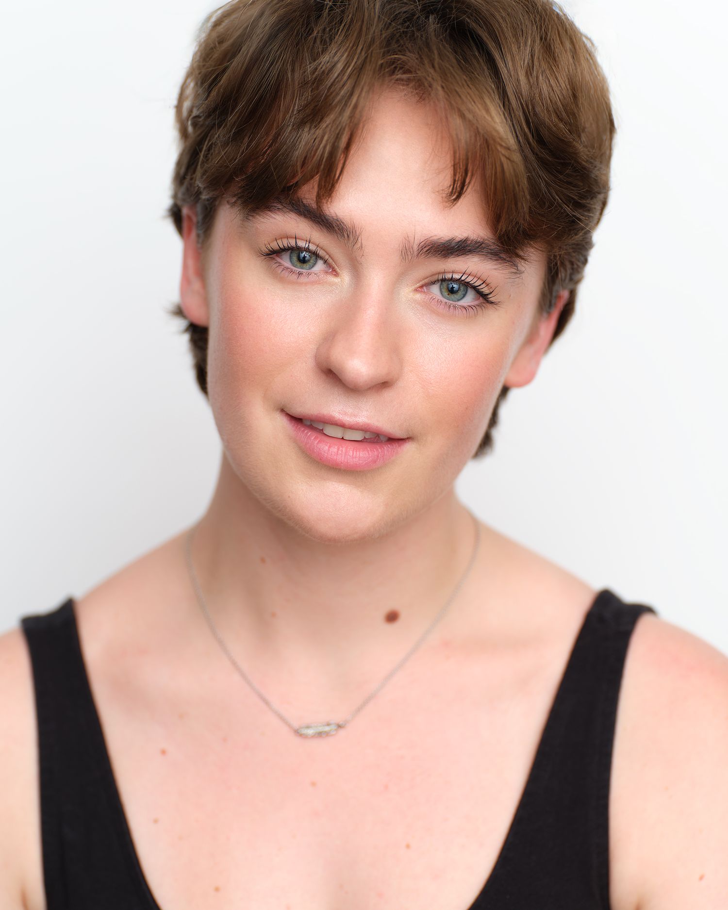 Bright, happy headshot for a female actor.