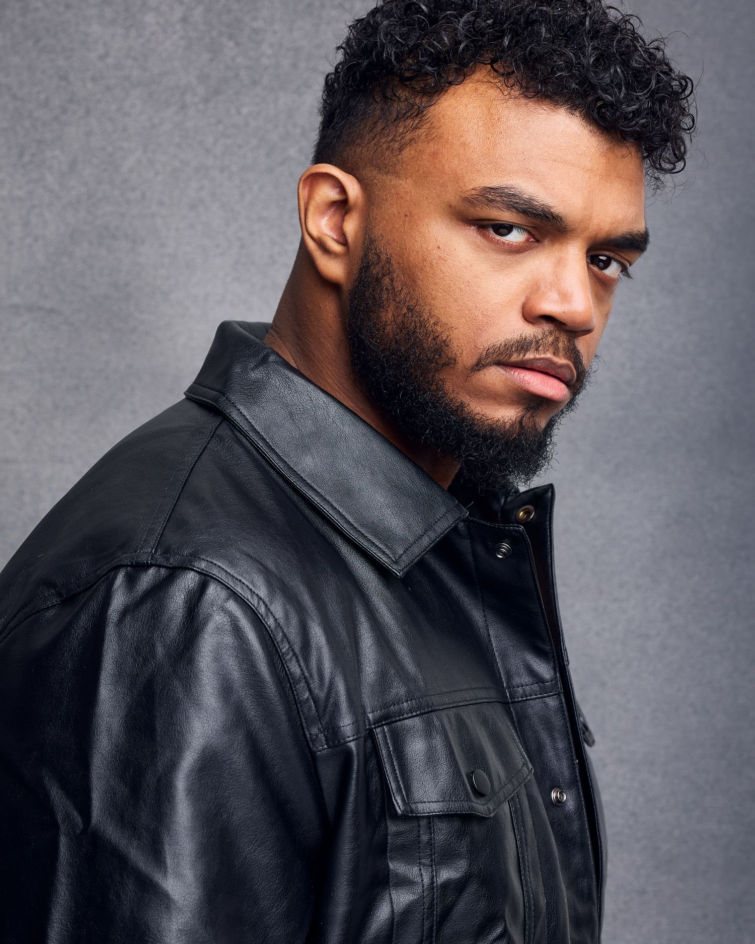 Dramatic headshot of a male of color for casting a NYC drama or crime show.