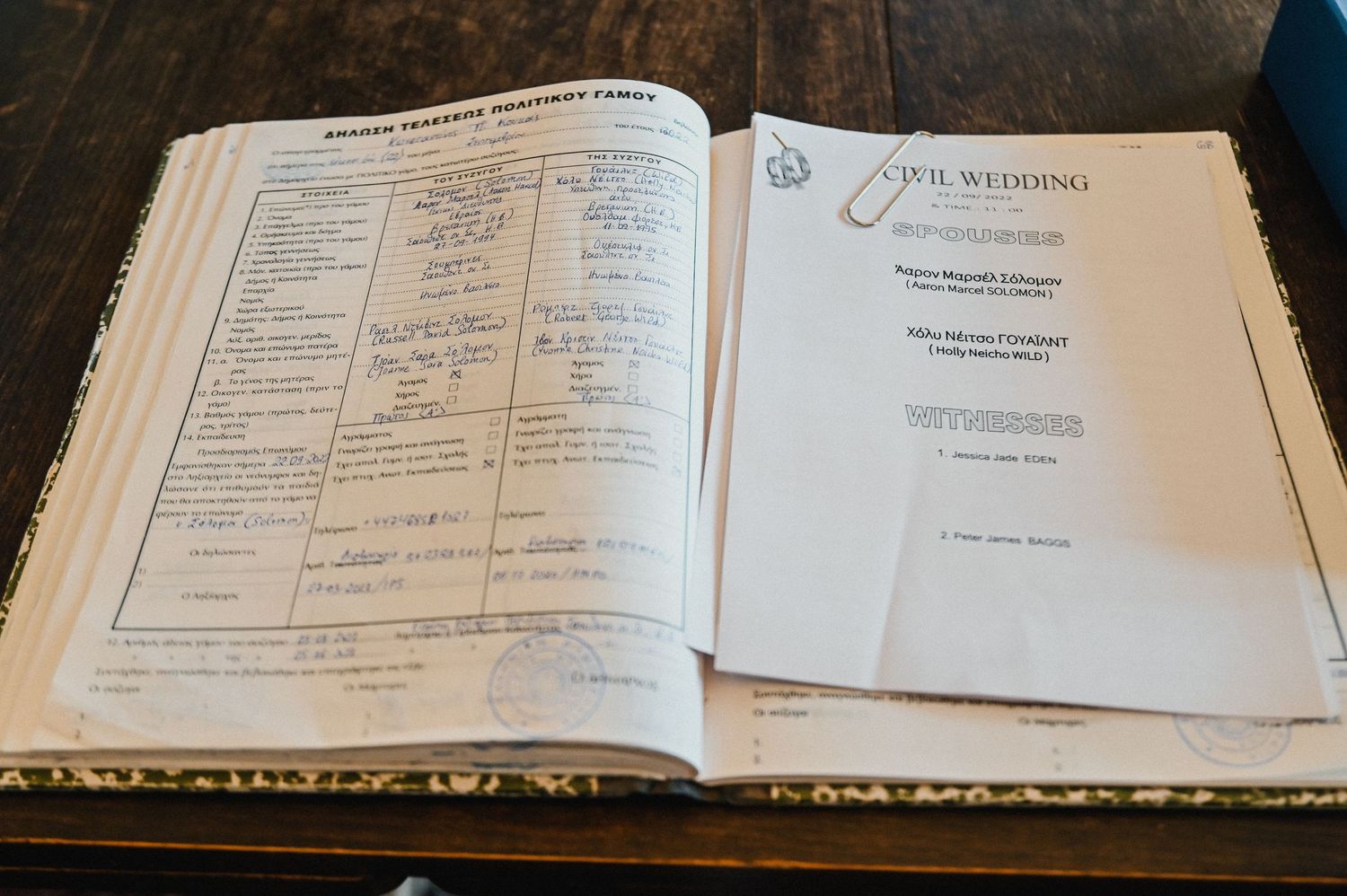 An open registration or legal document book displayed on a table.