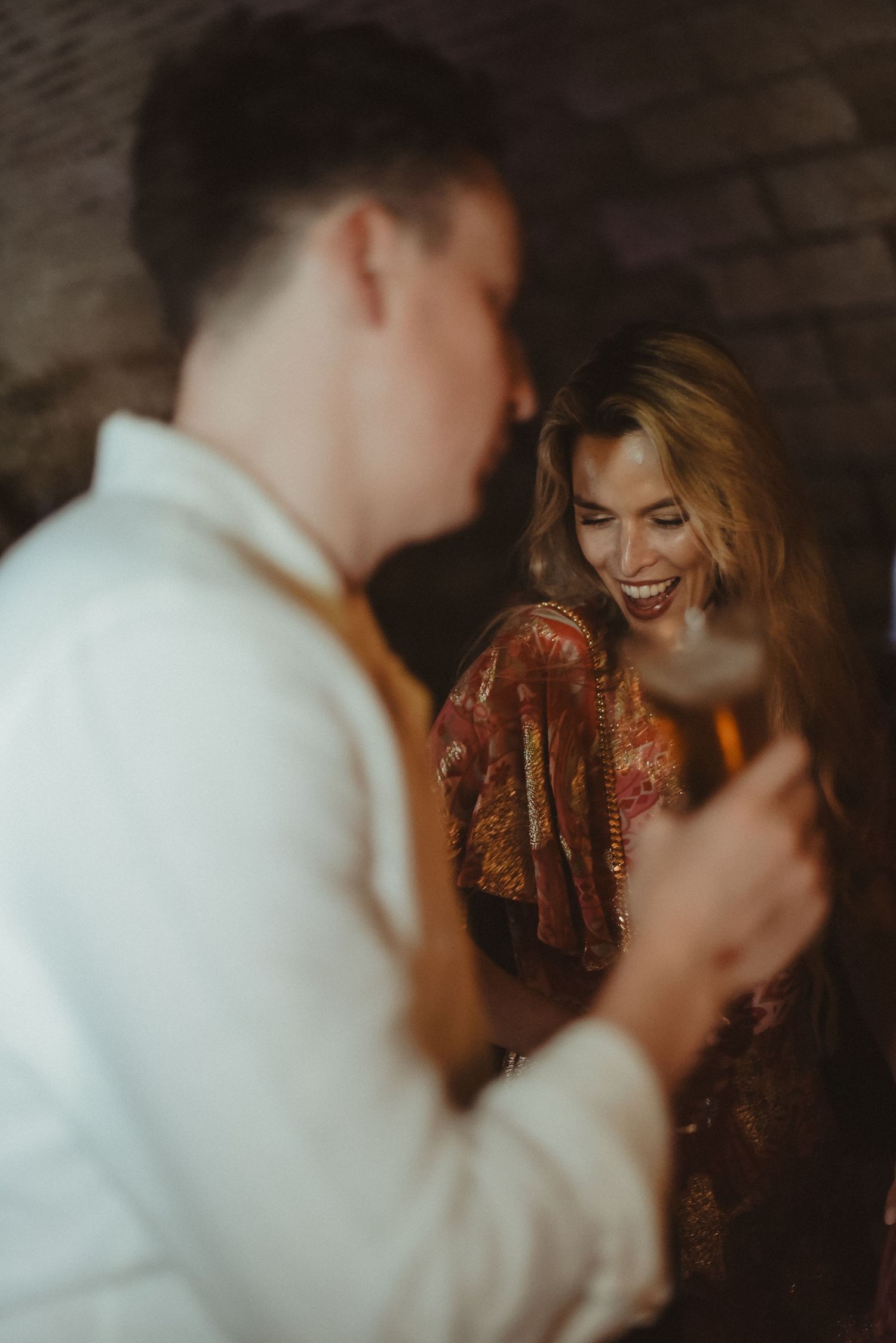 A candid moment of laughter and joy captured during a celebration.
