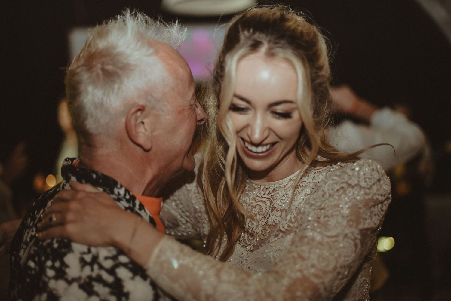 A candid moment of joyful dancing captured at a celebration event.
