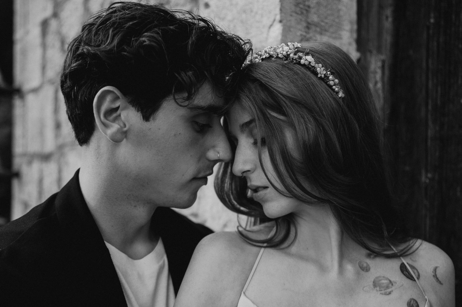 A close intimate black and white portrait showing gentle affection.