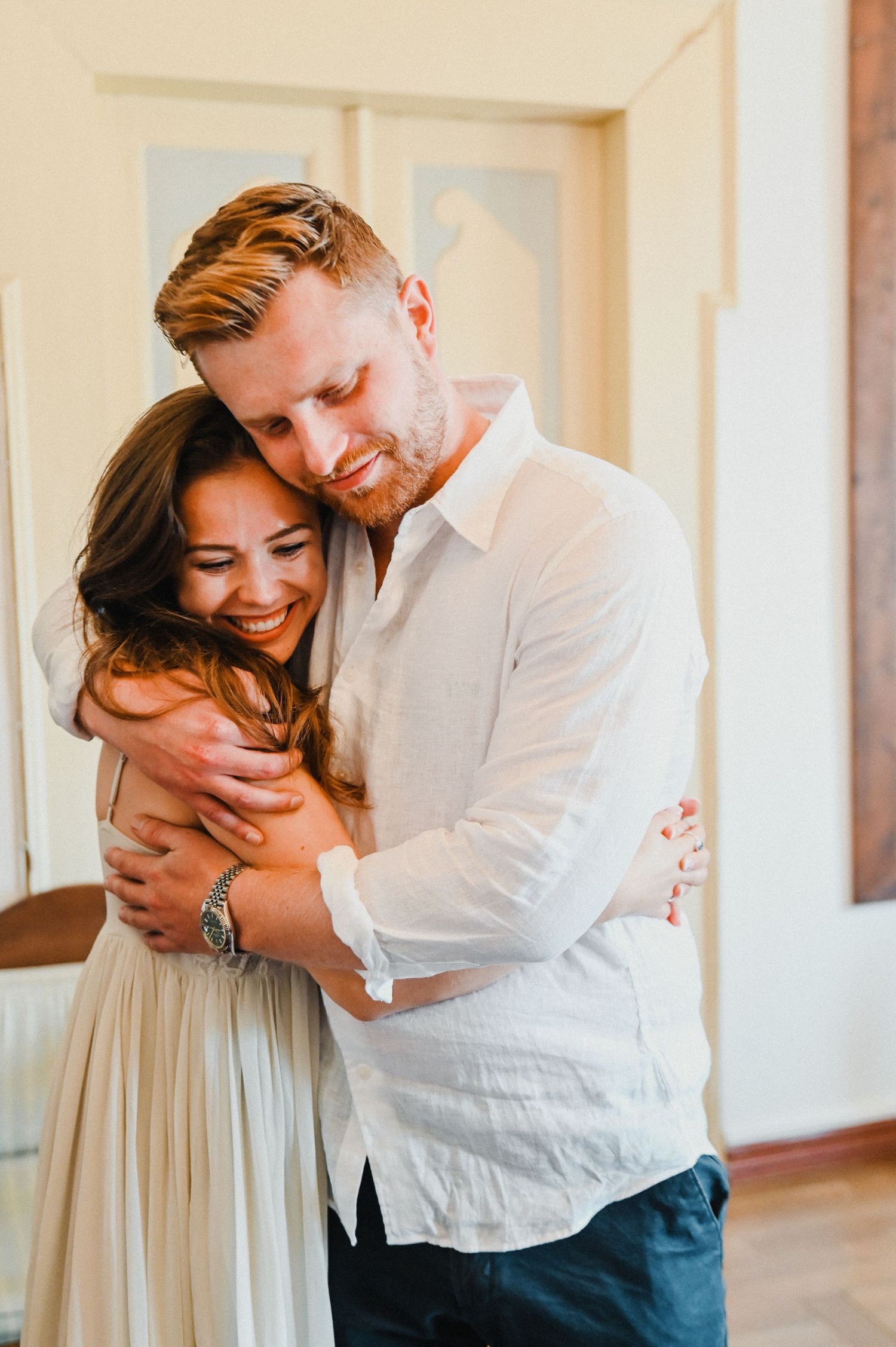 An intimate embrace captured during a special moment indoors.