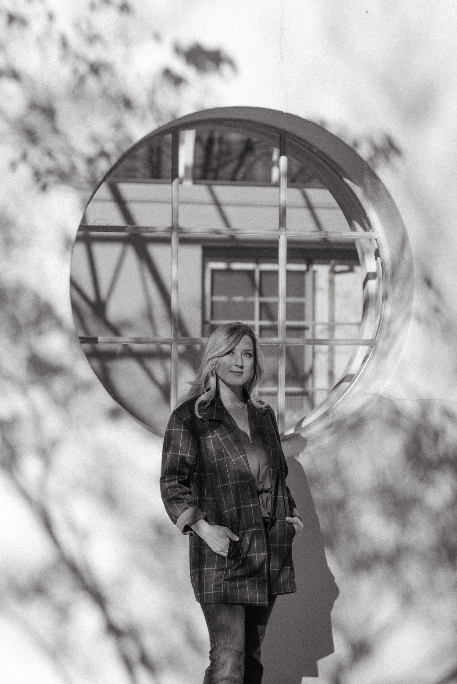 Black and white artistic portrait series showing a figure with an umbrella in multiple poses.