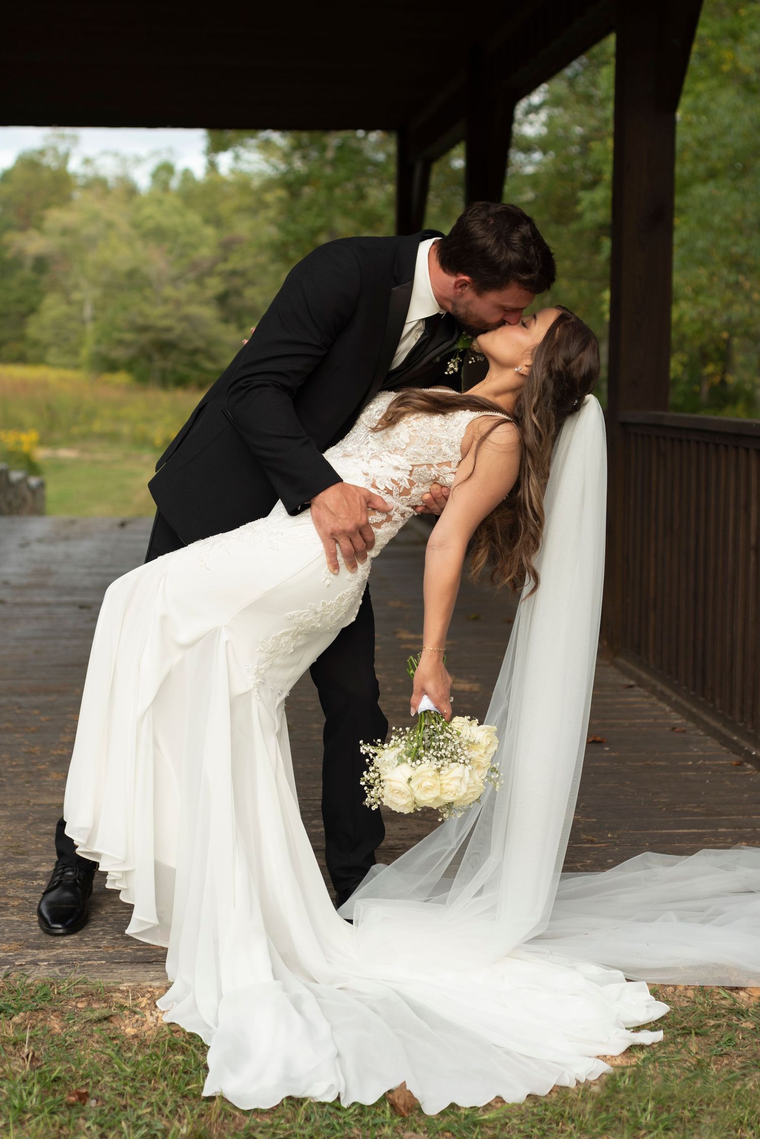 Artistic wedding dip poses captured in sequence on a wooden deck.