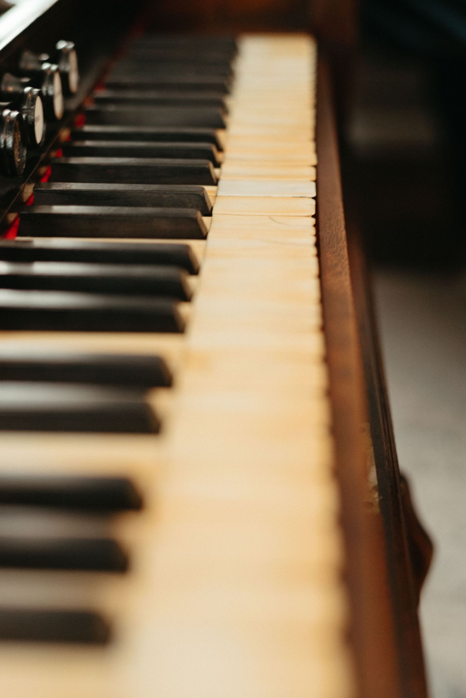 Close-up view of piano keys showing black and white keys in shallow depth of field.