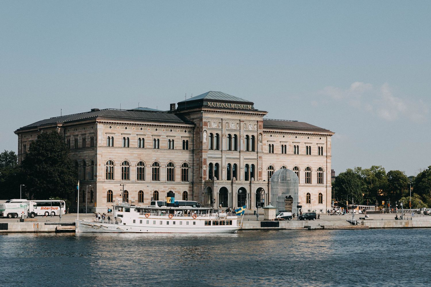 Grand neoclassical National Museum of Sweden building viewed from the waterfront in Stockholm.