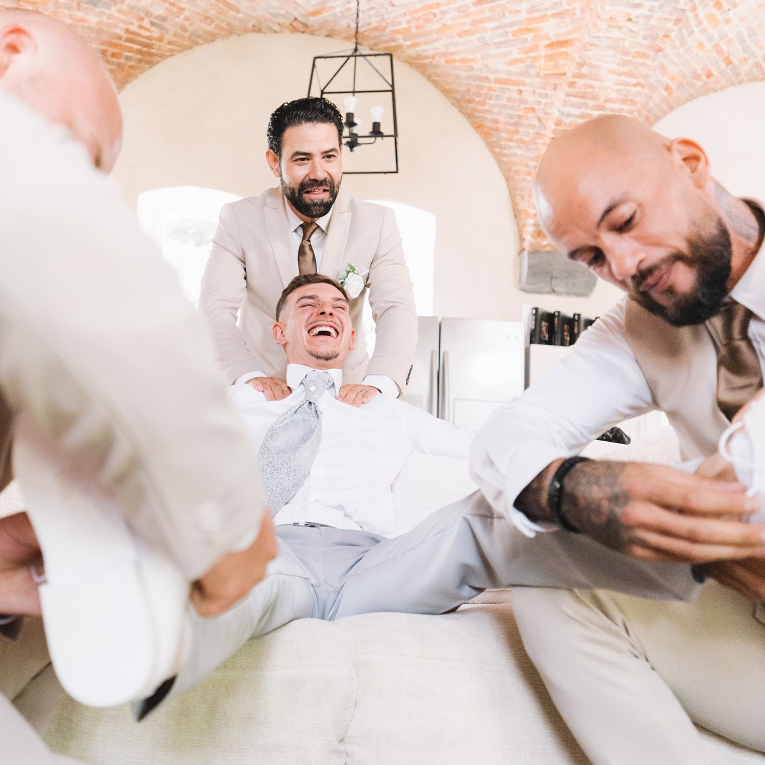 Candid sequence showing joyful reactions and laughter during wedding preparations.