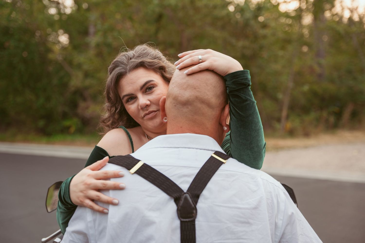 Tender embrace captured in a series of romantic outdoor portrait shots.