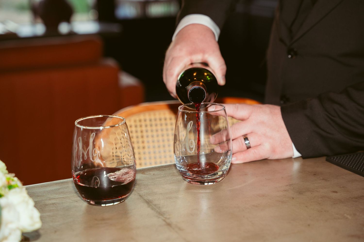Wine glasses and table settings at an intimate reception.