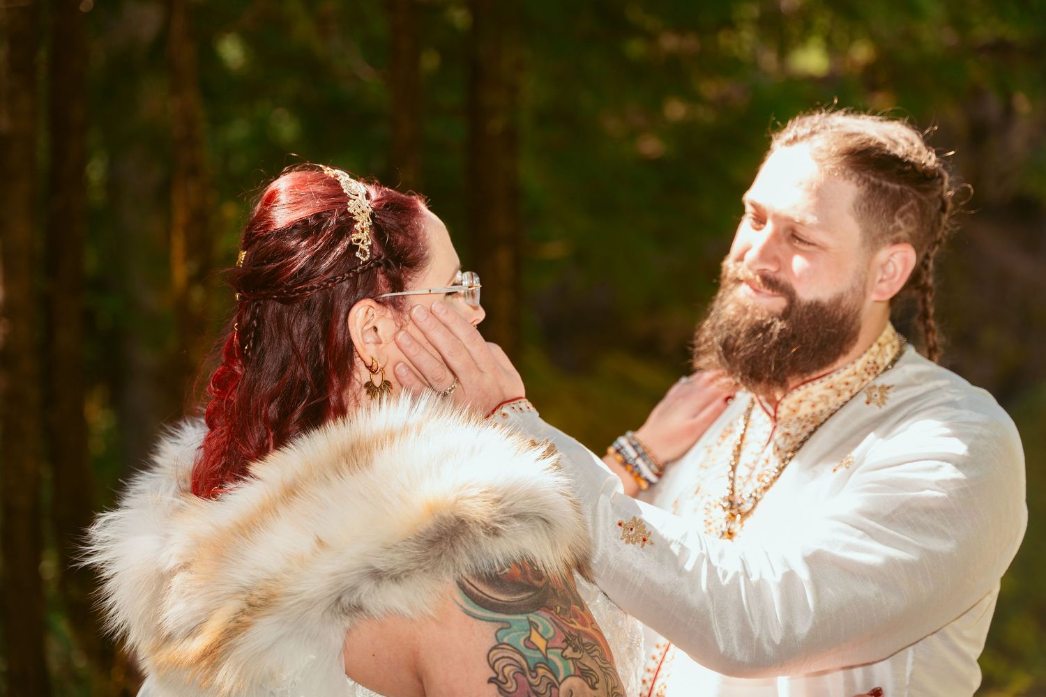 Wedding couple shares intimate moments during their medieval-themed forest celebration.