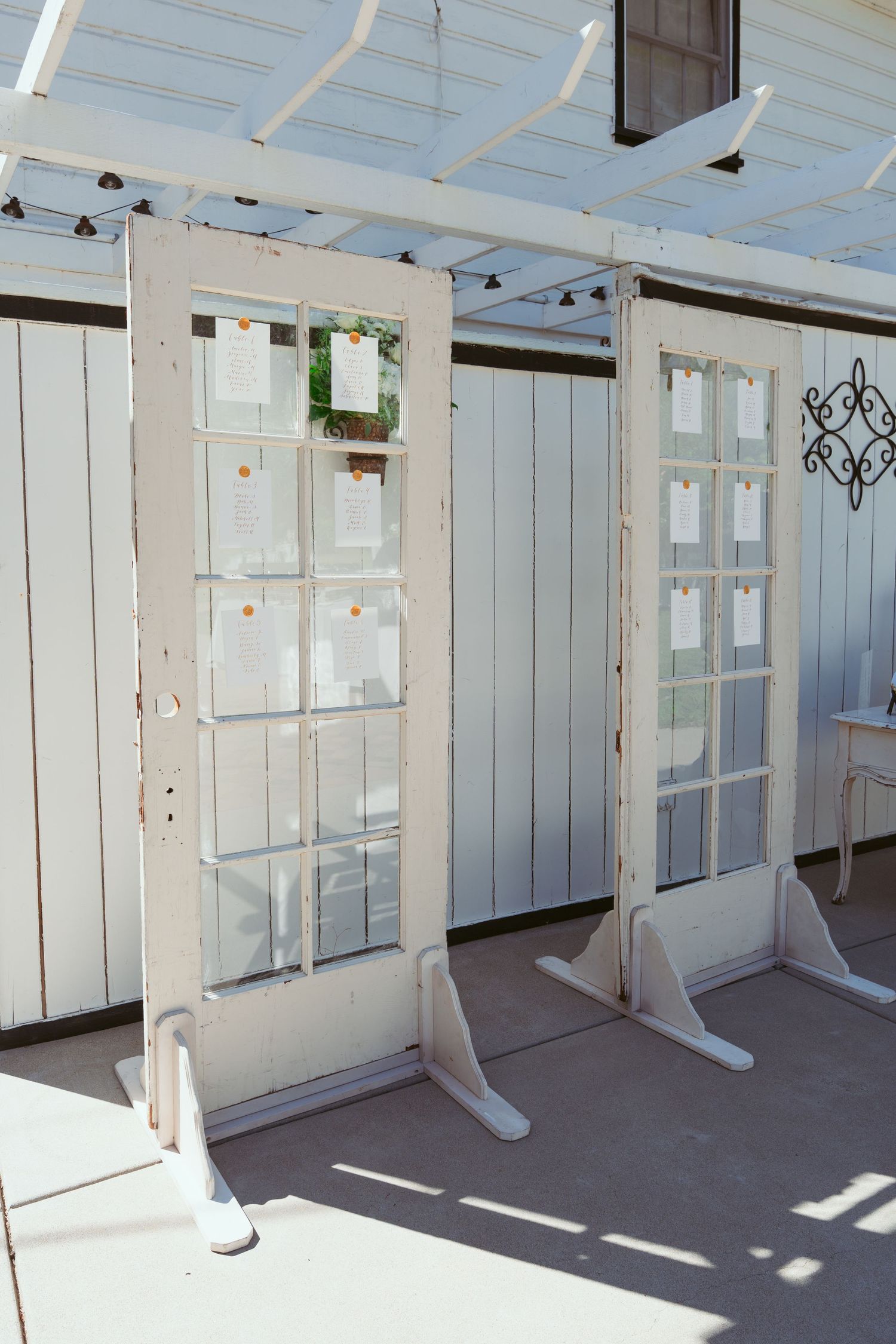 White painted interior room with multiple windows and divider screens.