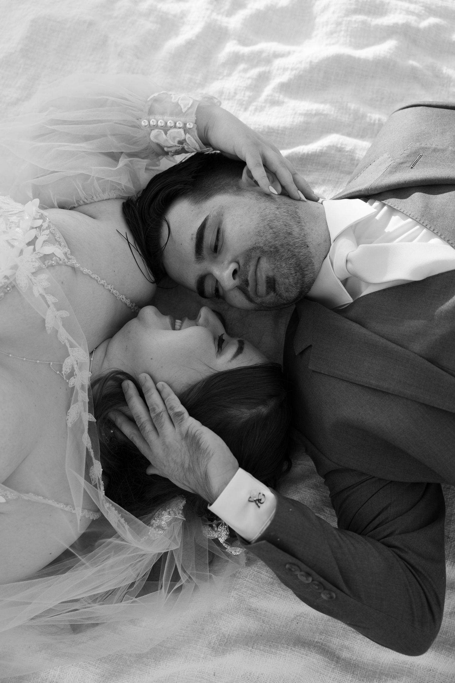 Black and white close-up wedding portrait showing emotional connection.