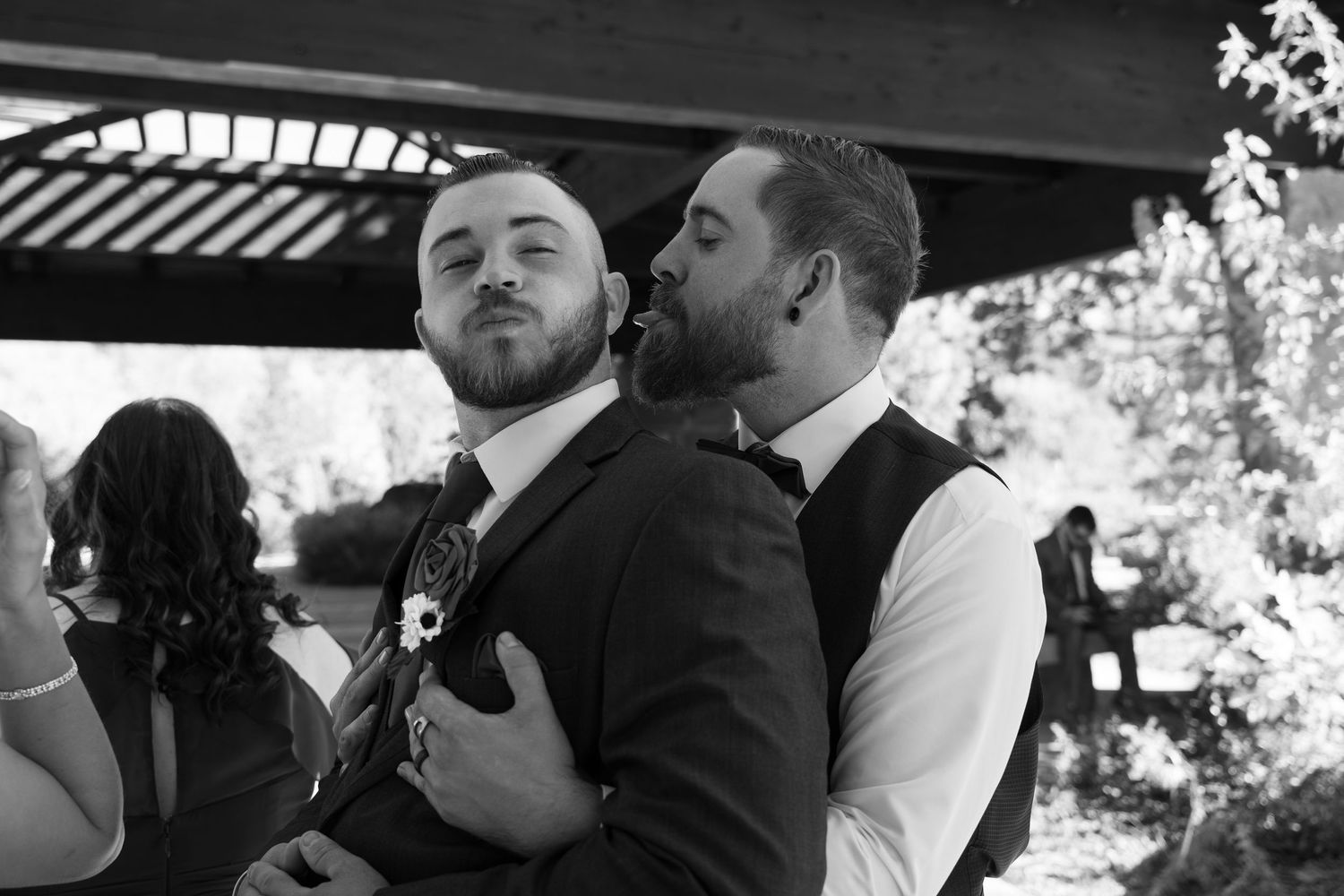 Series of romantic black and white wedding moments under covered outdoor venue.