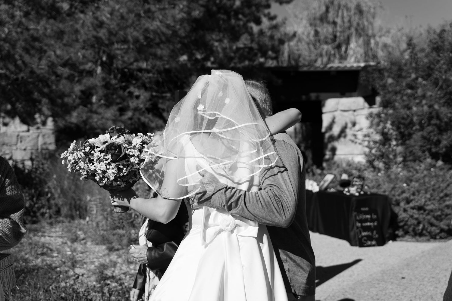 Wedding party poses for candid moments during outdoor autumn celebration.