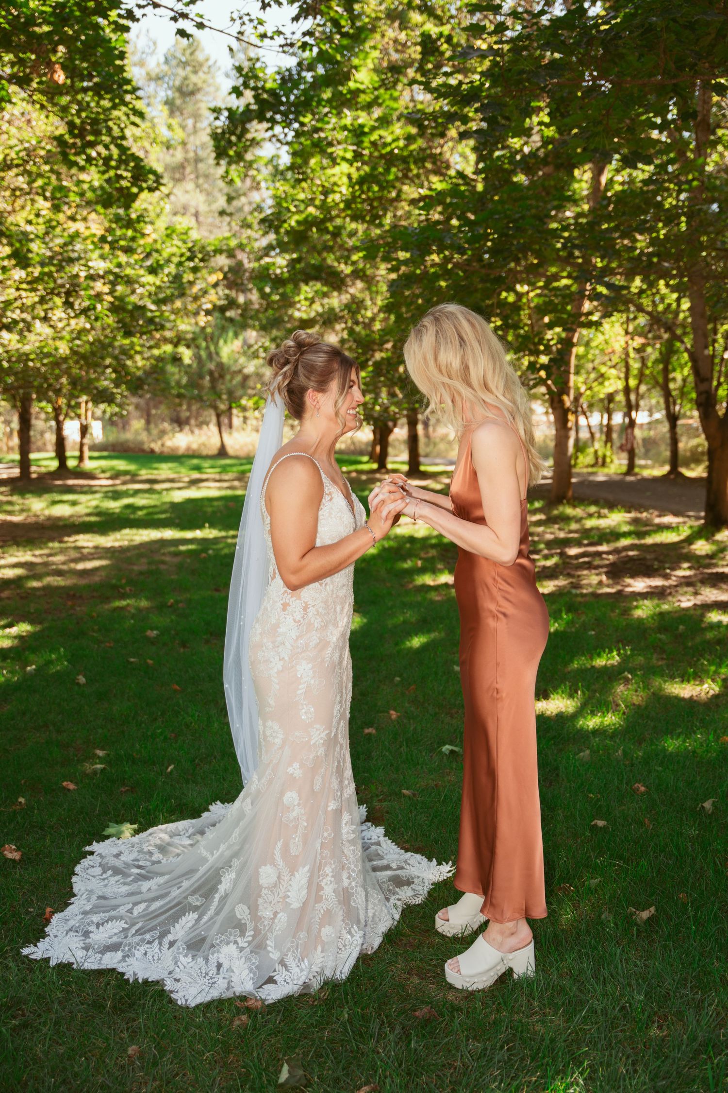 A sequence of candid moments between two people in a lush garden setting, with one wearing a flowing white dress.