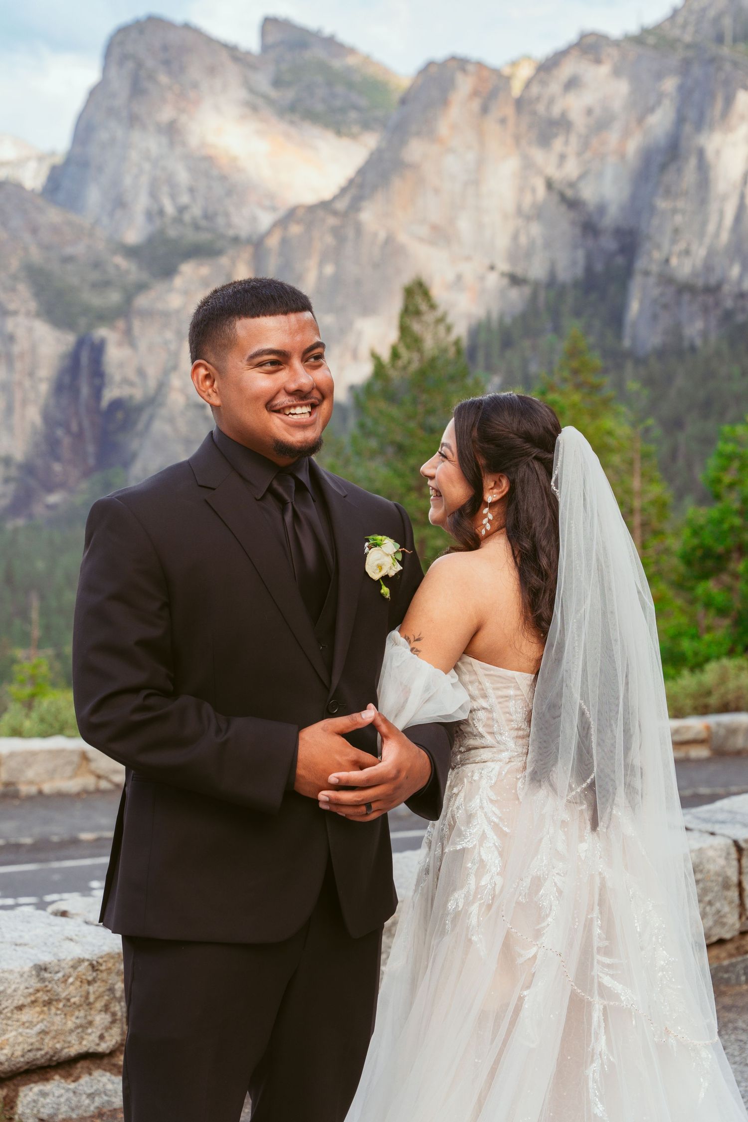 Candid moments between newlyweds with Half Dome and Yosemite Valley as their backdrop.