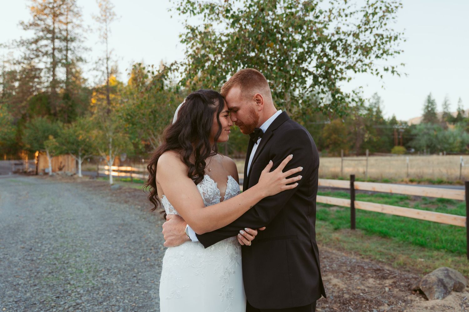 Romantic wedding couple shares an intimate moment outdoors during their autumn photoshoot.
