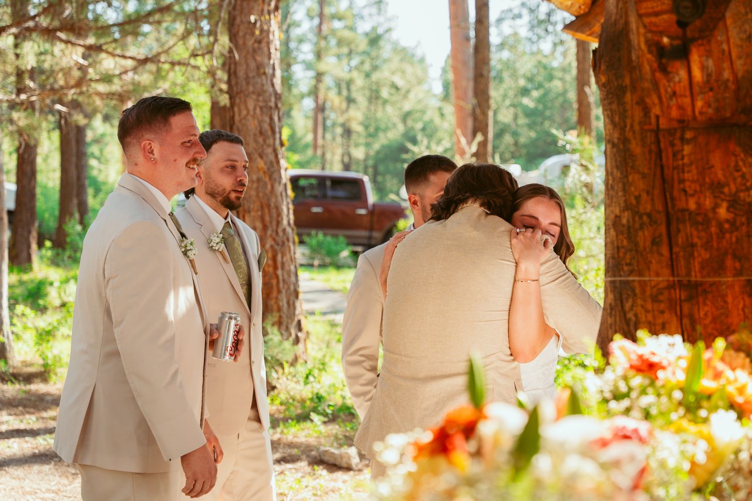 Couples share romantic dances under a wooden pavilion surrounded by pine trees.