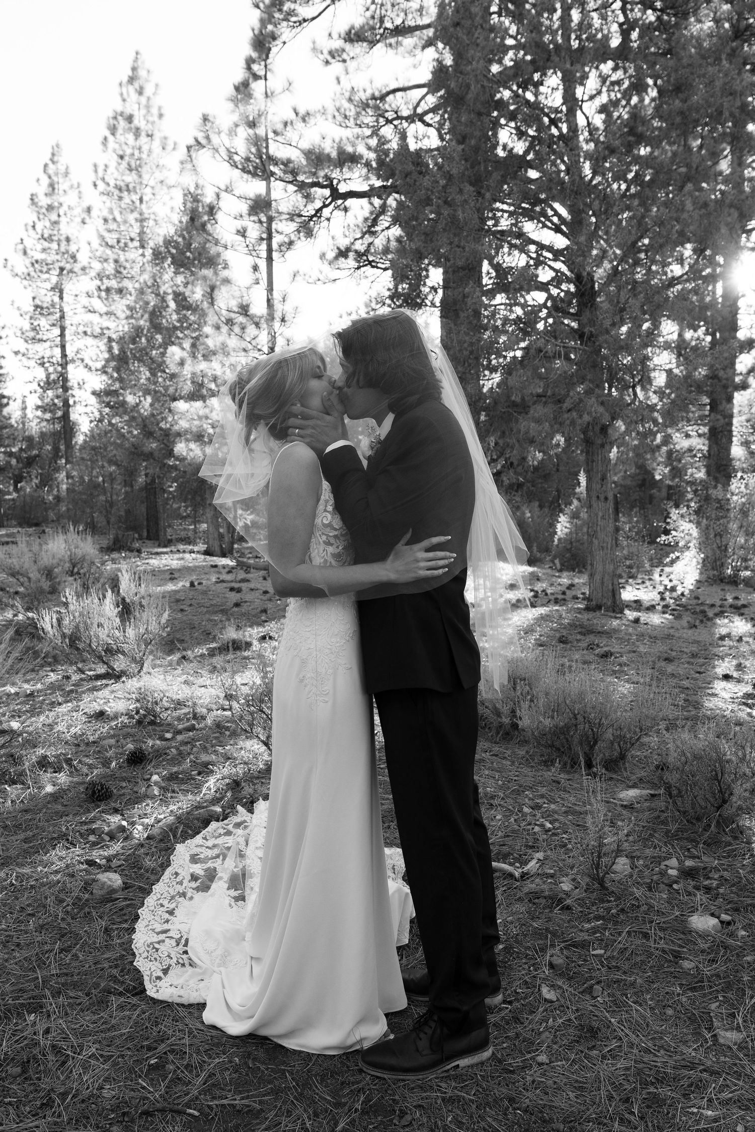 Black and white series of romantic wedding moments in a natural forest landscape.
