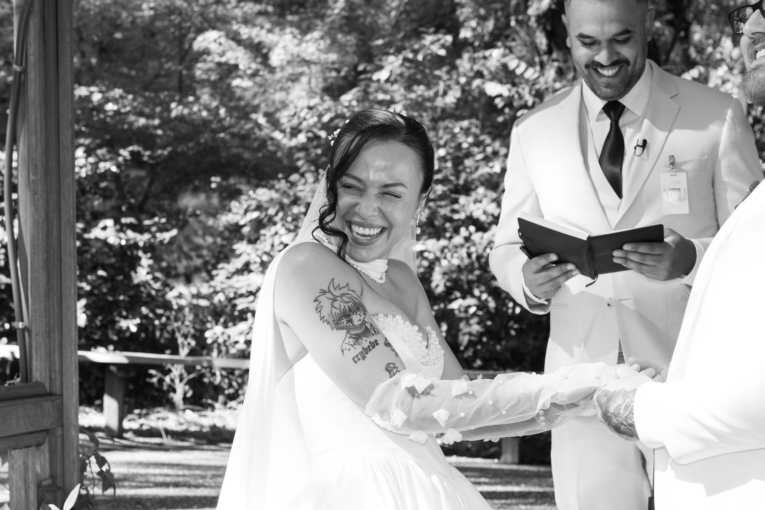 Black and white wedding photo series showing candid moments of celebration and joy.