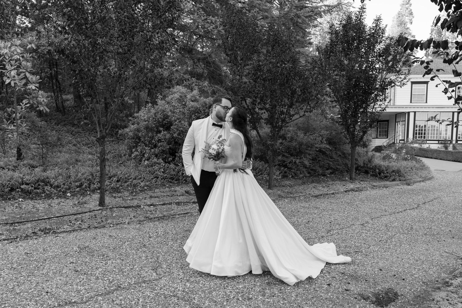 Artistic black and white wedding photography sequence showing a couple in a garden setting.