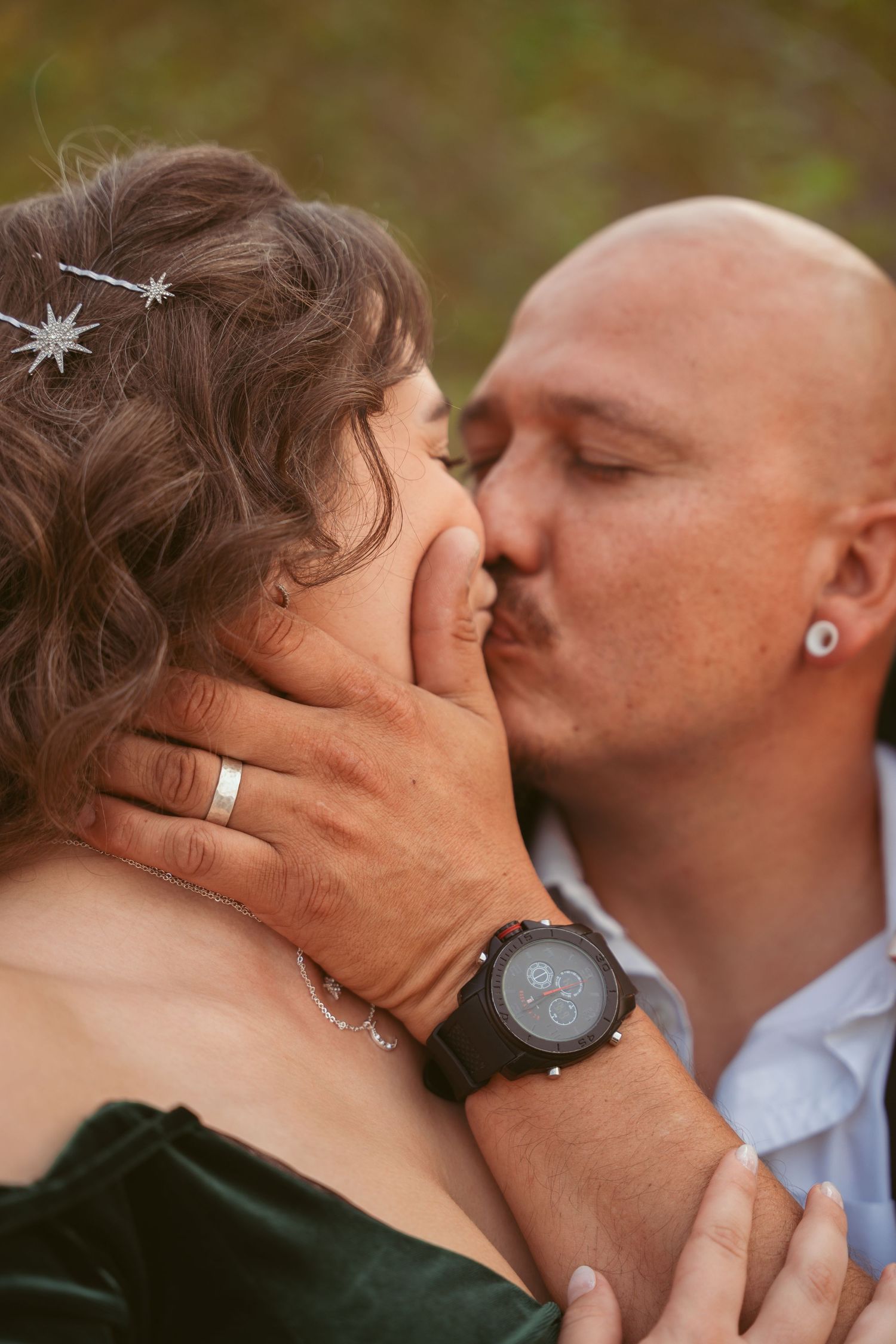 Intimate close-up shots of a couple kissing with golden hour lighting.