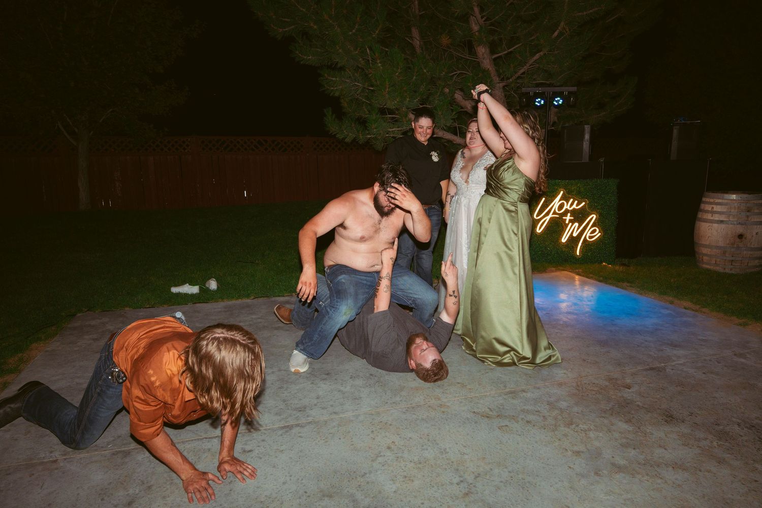 People dancing and having fun at a nighttime outdoor party.